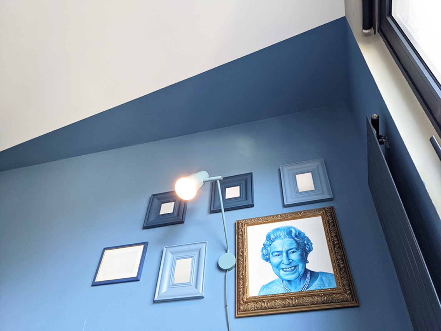 blue-bedroom-painting-interior-design-trends-2022-PGPstudio Interesting wall and ceiling painted in the corner of the room
